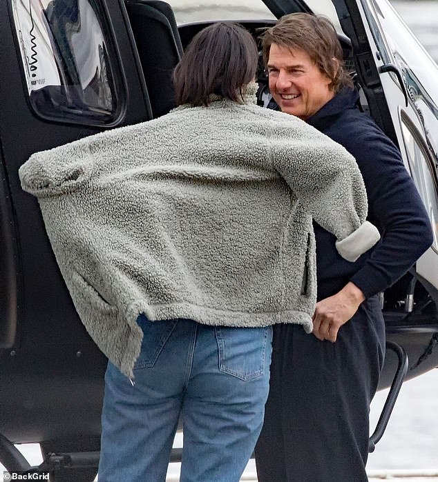 The couple appeared to be in high spirits after landing in London in Tom's helicopter.