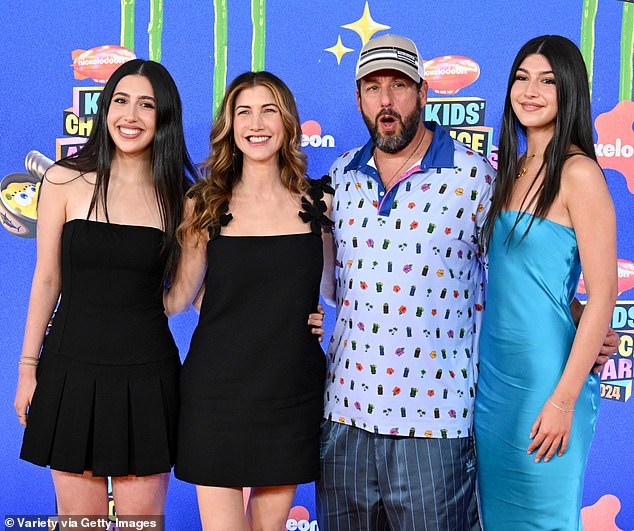 The family showed off their big smiles on the red carpet.