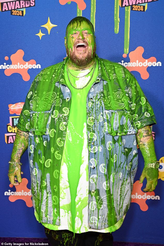 Backstage, Jelly Roll proudly showed off his slime-soaked physique.