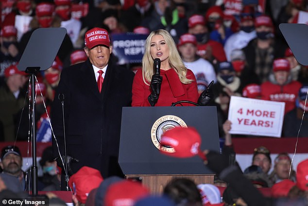 President Donald Trump listens to his daughter Ivanka Trump speak during a campaign rally at Kenosha Regional Airport on November 2, 2020 in Kenosha, Wisconsin.