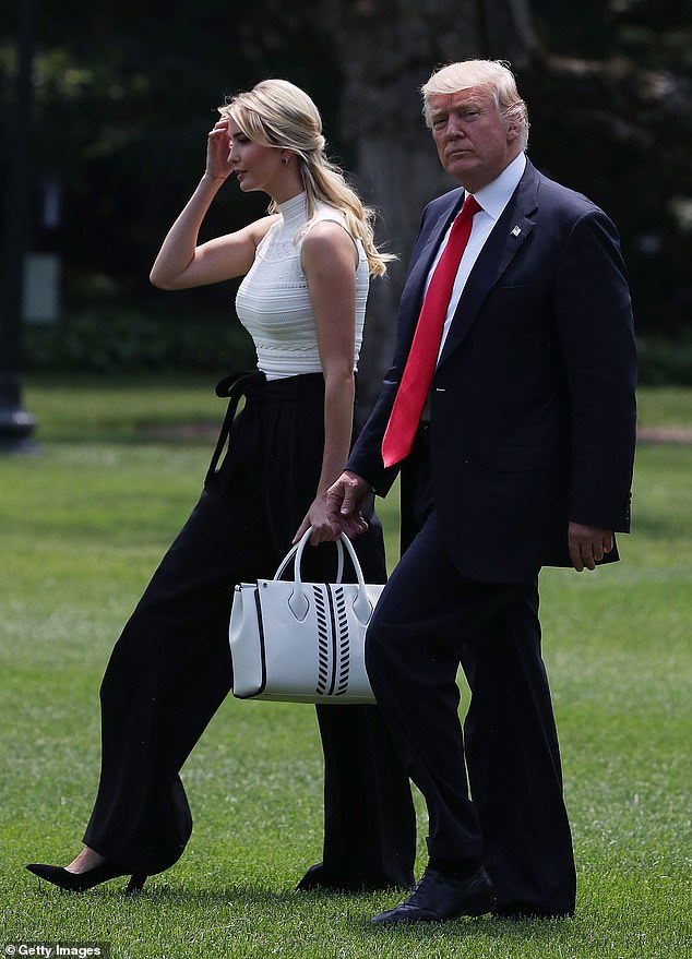 President Donald Trump and his daughter Ivanka Trump walk toward Marine One before departing the White House June 13, 2017 in Washington, DC.