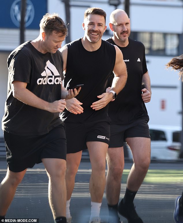 The handsome trainer was all smiles as he hit the pavement in preparation for the upcoming City2Surf race.