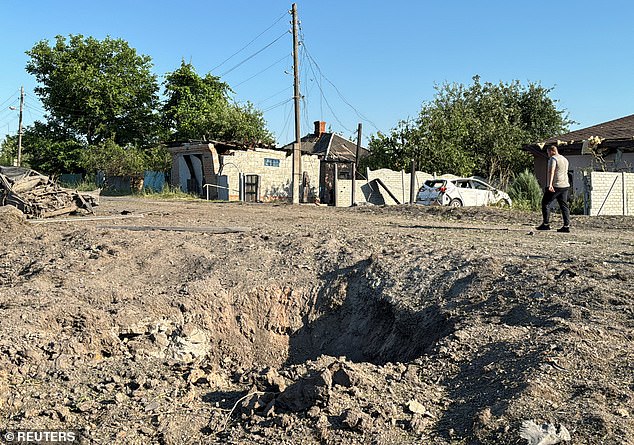 A view shows the site of a Russian missile strike, amid Russia's attack on Ukraine, in the village of Budy, Kharkiv region.