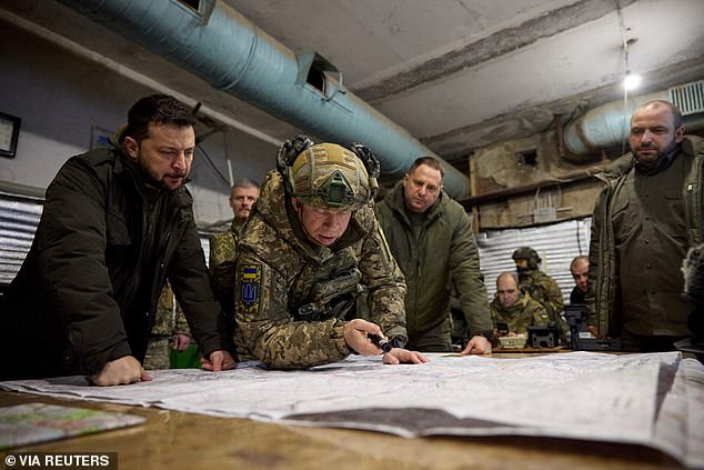 Ukrainian President Volodymyr Zelenskiy and Defense Minister Rustem Umerov listen to the commander of the Ground Forces, Colonel General Oleksandr Syrskyi, while visiting a Ukrainian military position in the city of Kupiansk.