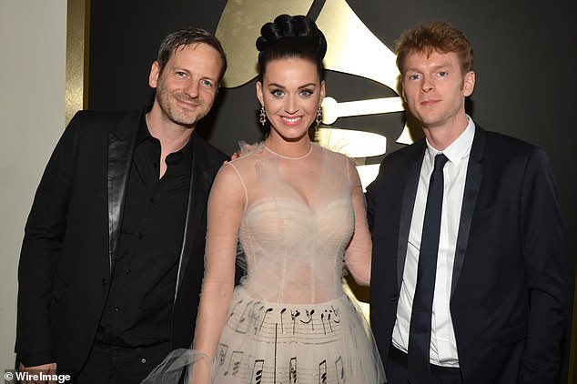 (L-R) Producer Dr. Luke, singer Katy Perry and producer Cirkut at the 56th Annual GRAMMY Awards in 2014. Perry has come under fire for working with Luke on her new single.