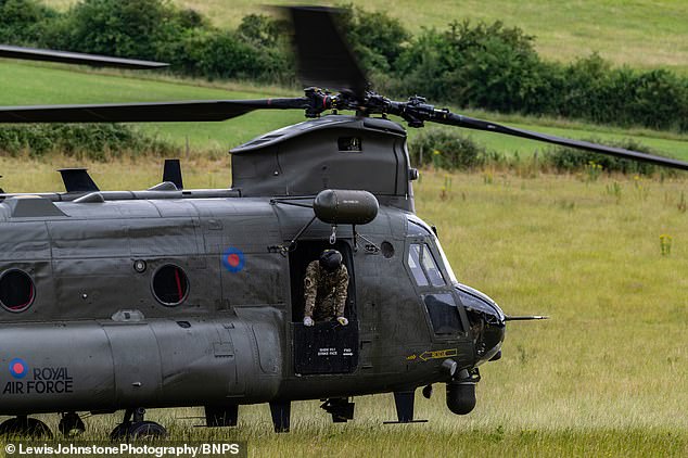 Boeing CH-47D ZA 671 is being guarded by the RAF in the middle of a field at Bere Regis, Dorset