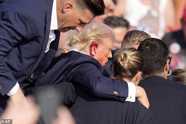 Blood can be seen gushing from the side of the former president's head.