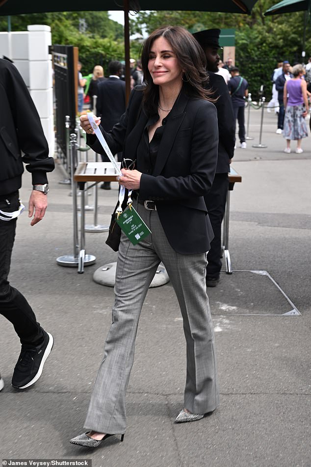 The Friends star snuggled up to the Snow Patrol rocker as they arrived hand-in-hand at the All England Lawn Tennis & Croquet Club in London.