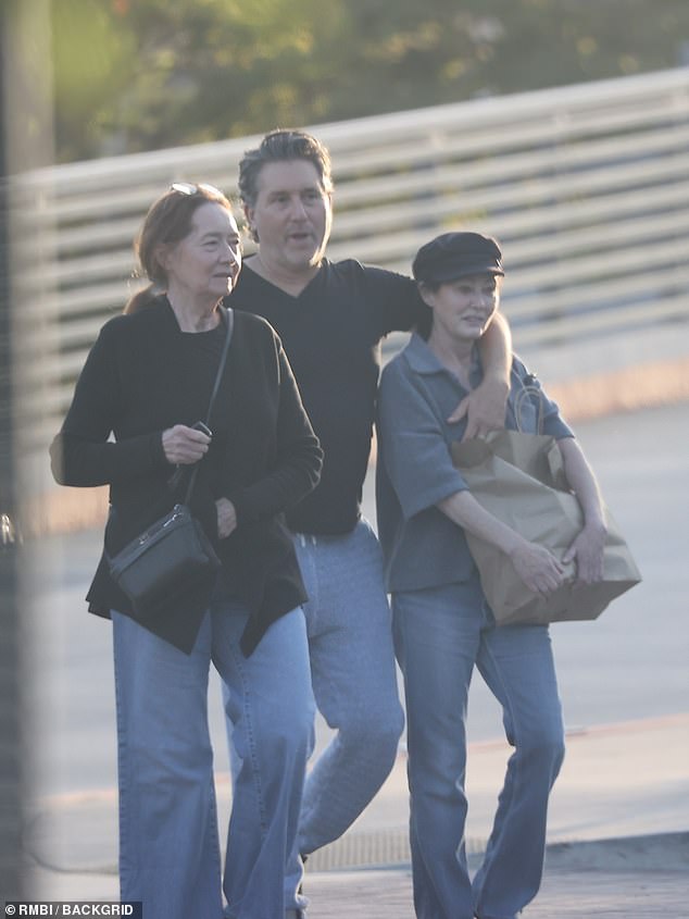 Shannen Doherty (right) and Chris Cortazzo (center) are seen sharing some PDA as they leave Kristy's Malibu after dinner.