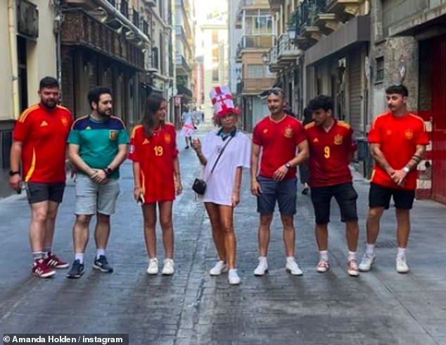 He was wearing a novelty hat while watching the game in Spain.