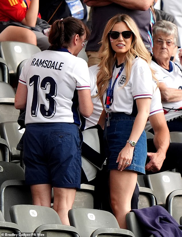 Georgina Irwin (right), wife of England goalkeeper Aaron Ramsdale, seen arriving in the stands in Berlin