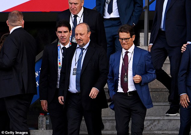 Former England manager Fabio Capello is at the game and was seen walking down some stairs with ex-Liverpool manager Rafael Benitez.