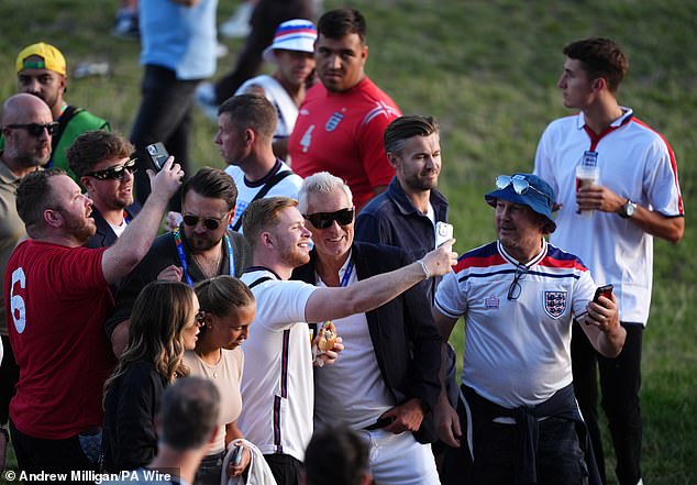 Martin and Roman were forced to take photos with some England fans