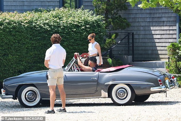 The Coach brand ambassador climbed into the passenger seat of Berry Gordy's 66-year-old protégé's sleek Mercedes convertible.