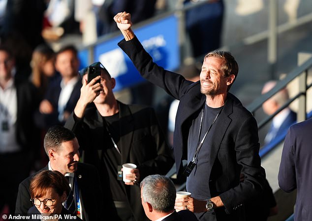 Peter couldn't wipe the smile off his face as he cheered on the boys and sang with the crowd.