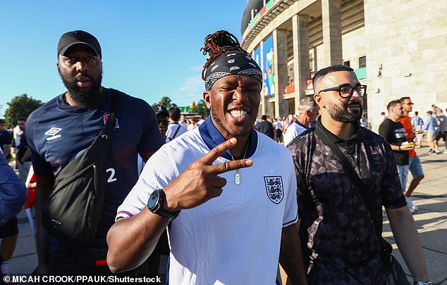 KSI flashed a peace sign as he posed with friends outside the UEFA Euros in his white and blue England shirt.