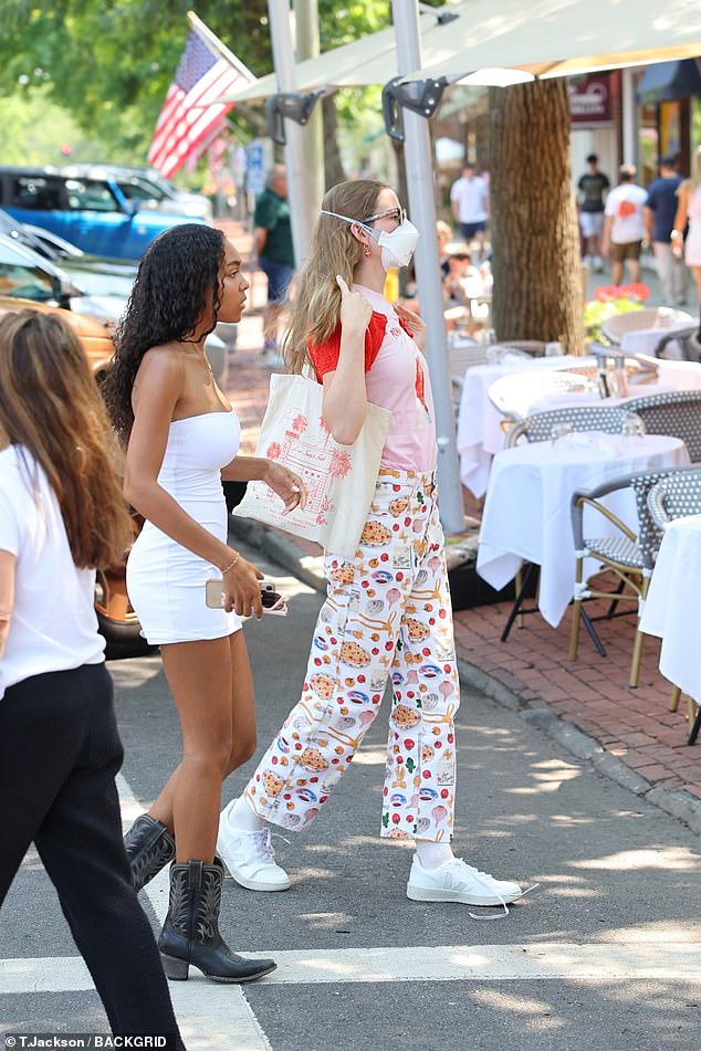 Ben Affleck's daughter wore a red and pink T-shirt, white patterned pants and sneakers. She also sported her signature glasses and a face mask.