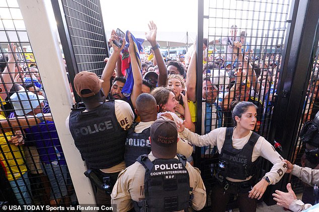 Fans rush to get into the gates ahead of the Copa America final match between Argentina and Colombia