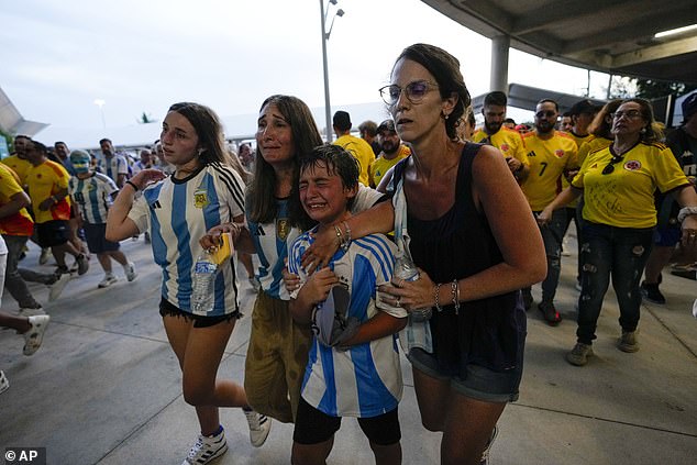 Argentine fans cry after successfully entering Hard Rock Stadium