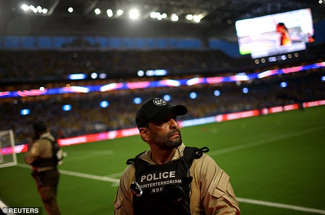 Police officers inside the stadium as the game is delayed due to incidents outside the stadium