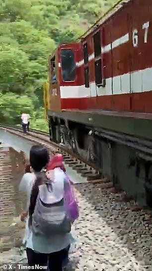 According to witnesses, the couple seemed oblivious to the imminent danger until the train was just a few metres away, while they were 