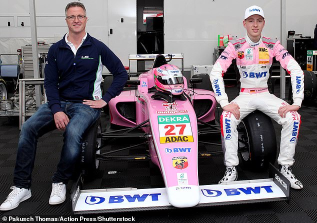 Ralf Schumacher is pictured with his son David Schumacher presenting their FIA Formula 4 car in 2018