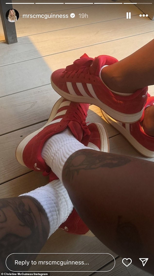 The 36-year-old model and her mysterious companion wore matching red Adidas trainers, with only the man's tattooed leg visible.