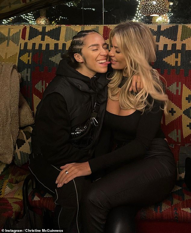 Christine's love life made headlines in 2022 when she was spotted sharing a kiss with her friend Chelcee Grimes (left)