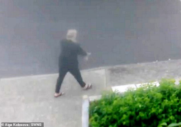 Caught red-handed: Woman throws full bag of excrement onto road next to property