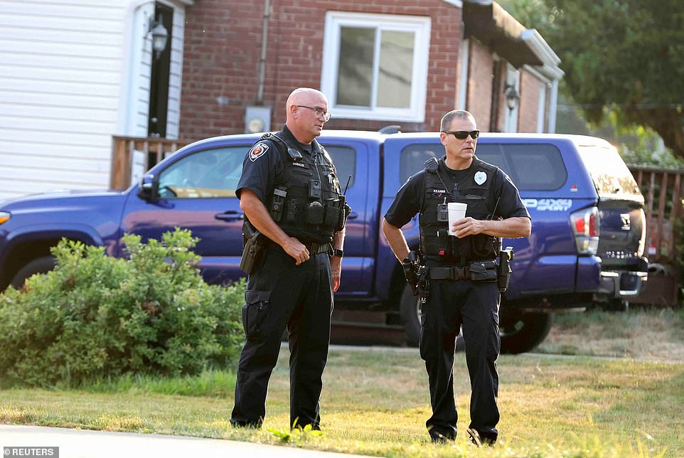 Bethel Park police officers talk outside Crooks' home Monday morning after the weekend shooting.