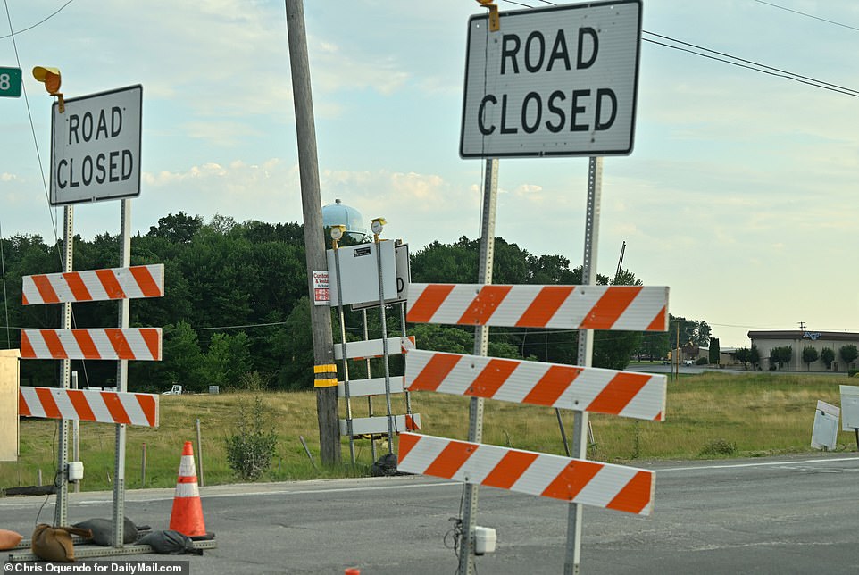 Police vehicles were lined up around the perimeter of the fairgrounds and large sections of the highway were closed to traffic as law enforcement investigated the scene.