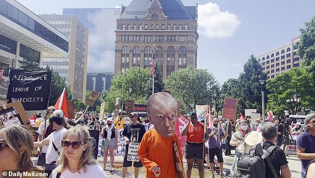 Activists gather at Red Arrow Park in downtown Milwaukee to protest Trump