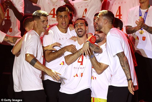 Chelsea full-back Marc Cucurella (centre) was the centre of the celebrations on stage