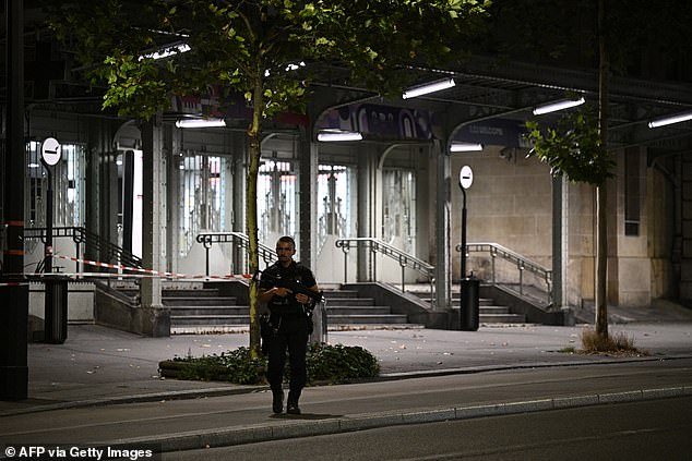 A police officer stands guard outside the Gare de l'Est train station, after the soldier was wounded in the shoulder by the knife-wielding suspect, in Paris on July 15, 2024.