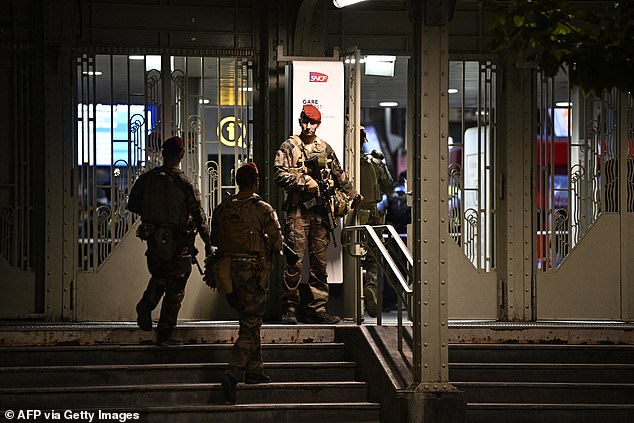 A French soldier was gardening outside the Gare de l'Est station after the attack.