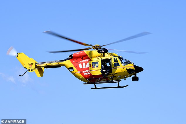 A rescue helicopter is on the way and police and the Queensland Ambulance Service have been called to the scene after two swimmers failed to surface at Millaa Millaa Falls, south of Cairns.