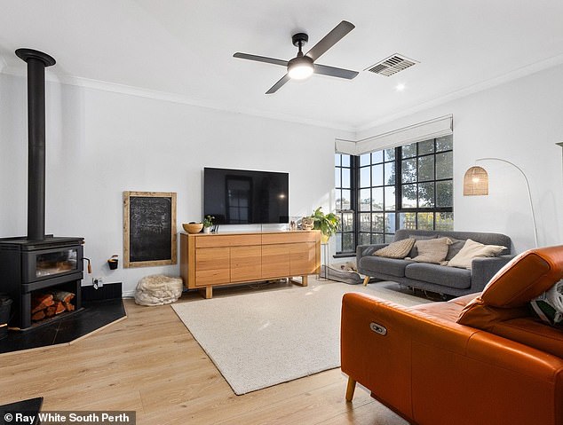 The three-bedroom Perth home features a wood-burning fireplace, 