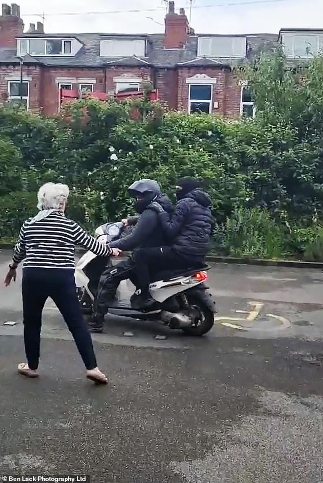 One of the elderly passersby is seen bravely intervening and chasing away the attackers by approaching them, despite the risks to her own safety. The attackers managed to quickly escape.