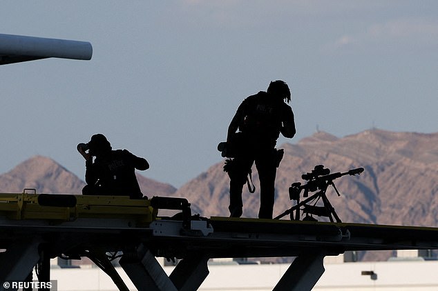 Members of the U.S. Secret Service sniper team stand guard near Air Force One at Harry Reid International Airport in Las Vegas.