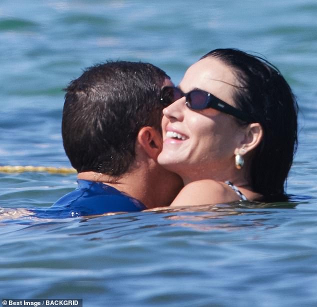 Lord of the Rings star Orlando cuddled up to Katy in the waves during their vacation