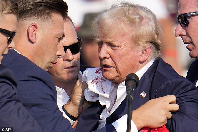 Trump was seen surrounded by the US Secret Service at a campaign event in Butler after a bullet fired by 20-year-old Thomas Matthew Crooks grazed his ear.