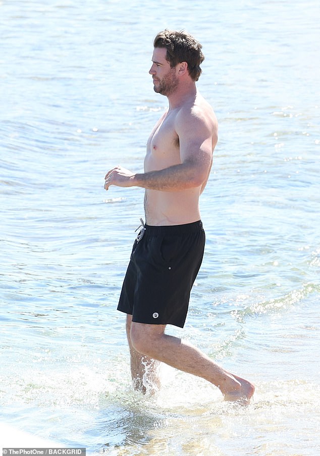 Liam, 34, kept it casual in a pair of black shorts.