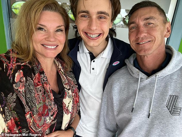 Pictured: Mat Rogers with his son Max and wife Chloe Maxwell, who also reacted furiously to the threat on social media.