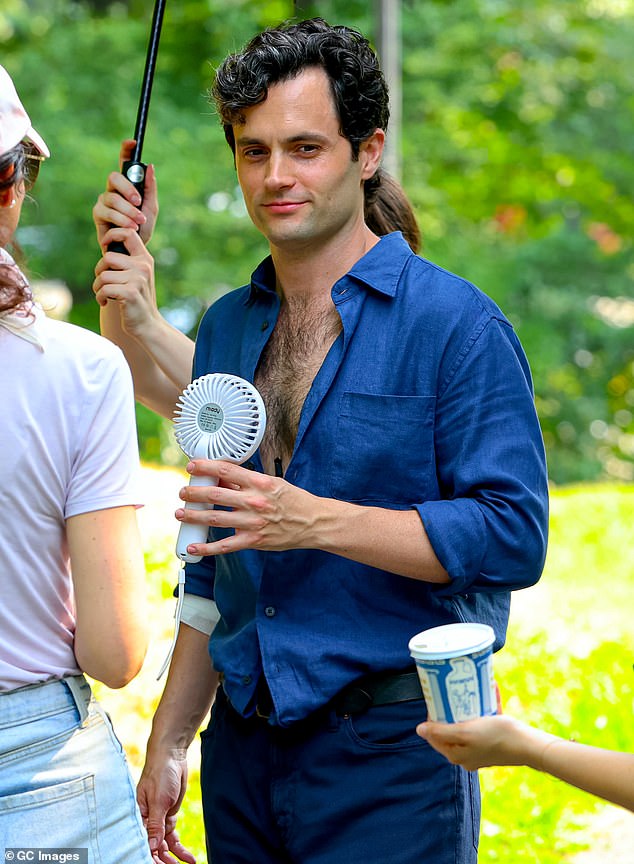 The Gossip Girl star showed off some chest hair in an unbuttoned blue shirt, which he paired with blue jeans.