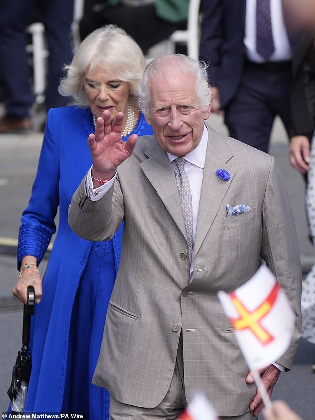 King Charles and Queen Camilla, dressed in splashes of royal blue, arrived on the Channel Island for the second day of their royal tour.