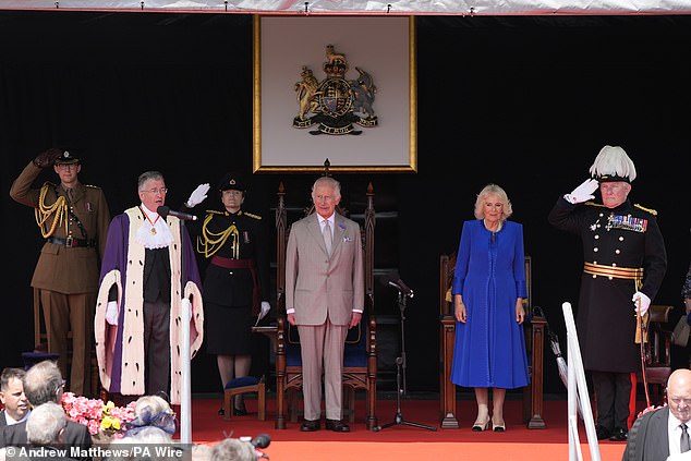 Greetings to the King and Queen: The lords and ladies pay homage to Charles and Camilla