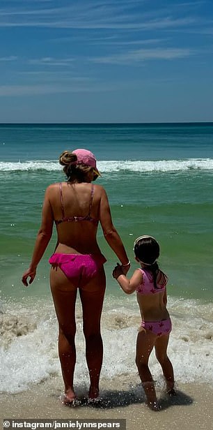 She looked sensational in the snaps, showing off her toned figure in a pink and purple printed bikini.