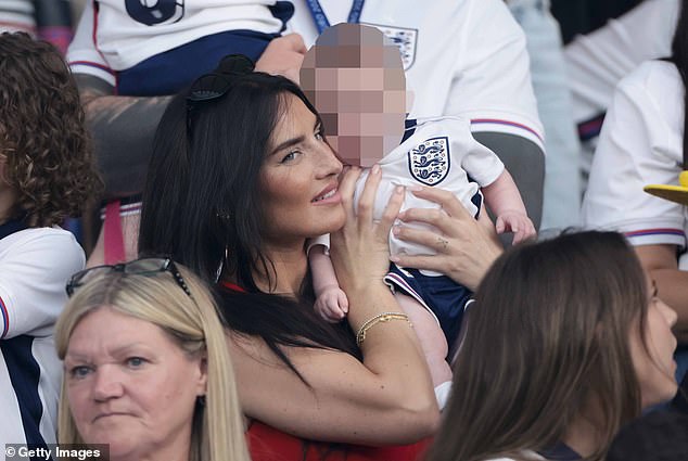 Walker was supported by his wife Annie Kilner, 32, at the Euro final, who was seen holding their two-month-old baby, Rezon.