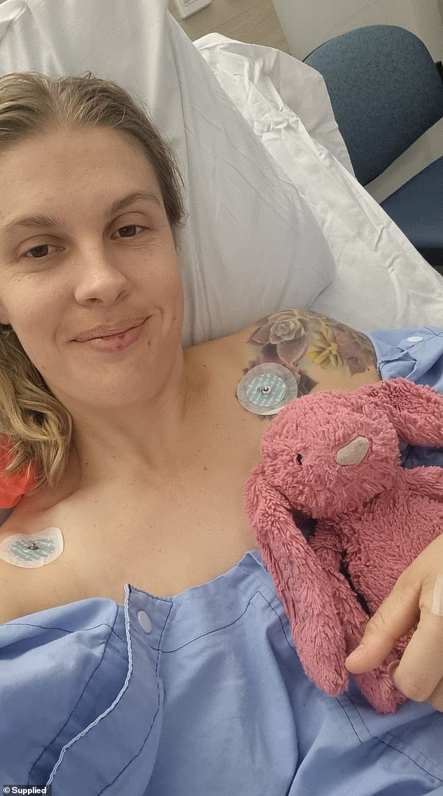 Just over two weeks ago, Ms Macnamara had her entire thighbone removed from her hip socket in an operation called a hip disarticulation (pictured recovering in hospital).