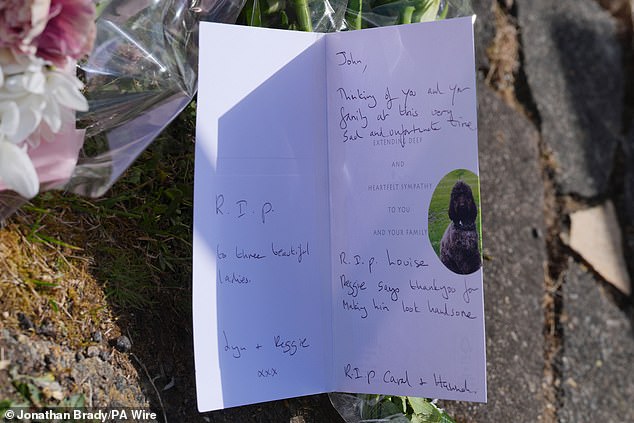 Well-wishers left handwritten messages of condolence on cards.